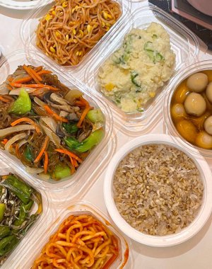 Warm and comforting jibbap (home-cooked Korean meal) with a spread of rice, soup, and banchan, offering a perfect harmony of flavor, tradition, and heartwarming nourishment in every bite.
