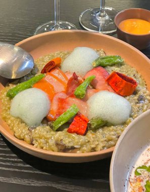 Creamy risotto cooked to perfection with rich, buttery texture and savory flavors. A classic Italian dish perfect for gourmet menus, food blogs, and elegant dining promotions.