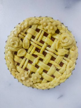 Warm and comforting apple pie with a golden, flaky crust and sweet cinnamon-spiced apple filling, offering a perfect bite of classic homemade flavor and cozy indulgence in every slice.