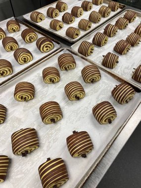 Buttery and flaky pain au chocolat with a golden, crispy crust and rich, melted chocolate filling. A classic French pastry perfect for breakfast or an indulgent snack.