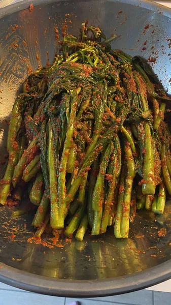 Pa kimchi, a flavorful Korean side dish made with scallions, fermented in a spicy, tangy seasoning. Perfect for enhancing meals, this vibrant dish captures the essence of traditional Korean cuisine.