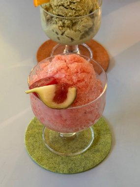 Es puter, a traditional Indonesian ice cream made from coconut milk, sugar, and various flavors, often served with toppings like fruits or nuts. Refreshing and delightful!