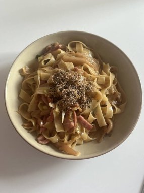 Creamy spaghetti carbonara made with rich egg yolk sauce, crispy bacon, parmesan cheese, and freshly ground black pepper for a classic, indulgent Italian pasta dish.