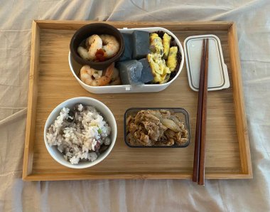 Warm and comforting jibbap (home-cooked Korean meal) with a spread of rice, soup, and banchan, offering a perfect harmony of flavor, tradition, and heartwarming nourishment in every bite.