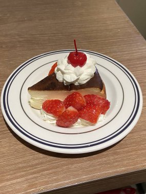 Soft and creamy cheesecake slice topped with juicy peach slices, blending rich, velvety texture with a sweet, fruity twist. A perfect balance of indulgence and freshness for a delightful dessert.