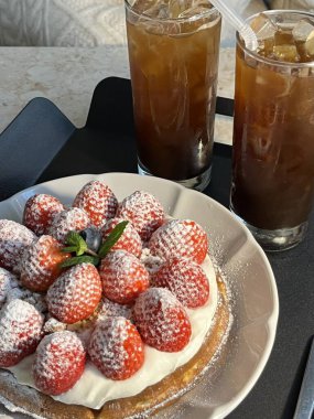 Crispy, golden waffles topped with creamy ice cream, creating a perfect balance of warm and cold, crunchy and smooth. A delightful dessert or breakfast treat, with toppings like fruits or syrup.