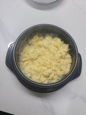 Steamed Korean egg dish, Gyeran Jjim, known for its light, fluffy texture. Served hot, often in an earthenware pot, this savory and comforting dish pairs well with rice and banchan.
