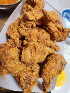 Crispy fried chicken with golden, crunchy skin and juicy, tender meat. A delicious and savory dish, perfect for any meal, served with dipping sauces or side dishes for extra flavor!