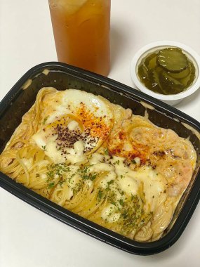 Creamy spaghetti carbonara made with rich egg yolk sauce, crispy bacon, parmesan cheese, and freshly ground black pepper for a classic, indulgent Italian pasta dish.