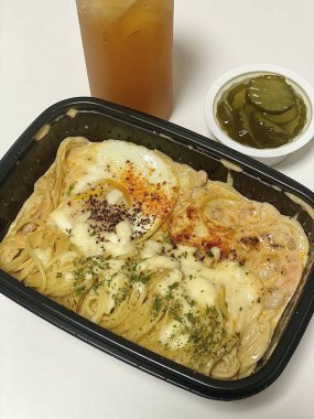 Creamy spaghetti carbonara made with rich egg yolk sauce, crispy bacon, parmesan cheese, and freshly ground black pepper for a classic, indulgent Italian pasta dish.