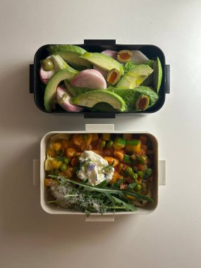 Bento or dosirak box filled with rice, assorted side dishes, vegetables, and protein like meat or fish, all neatly arranged to create a balanced, colorful, and visually appealing meal