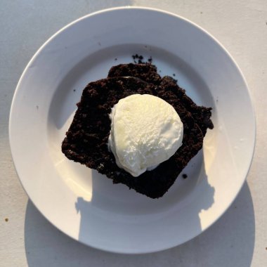 Rich, moist chocolate cake with a decadent, velvety texture and deep chocolate flavor. A perfect indulgence for dessert lovers, offering a satisfyingly sweet treat in every bite.