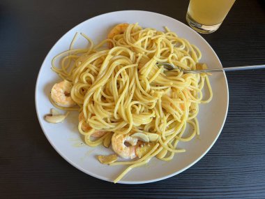 Creamy spaghetti carbonara made with rich egg yolk sauce, crispy bacon, parmesan cheese, and freshly ground black pepper for a classic, indulgent Italian pasta dish.