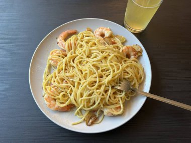 Creamy spaghetti carbonara made with rich egg yolk sauce, crispy bacon, parmesan cheese, and freshly ground black pepper for a classic, indulgent Italian pasta dish.