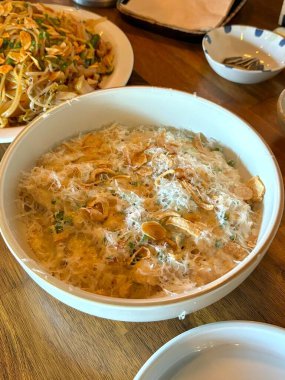 Creamy spaghetti carbonara made with rich egg yolk sauce, crispy bacon, parmesan cheese, and freshly ground black pepper for a classic, indulgent Italian pasta dish.