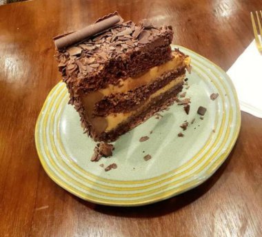 Rich, moist chocolate cake with a decadent, velvety texture and deep chocolate flavor. A perfect indulgence for dessert lovers, offering a satisfyingly sweet treat in every bite.