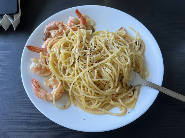Creamy spaghetti carbonara made with rich egg yolk sauce, crispy bacon, parmesan cheese, and freshly ground black pepper for a classic, indulgent Italian pasta dish.