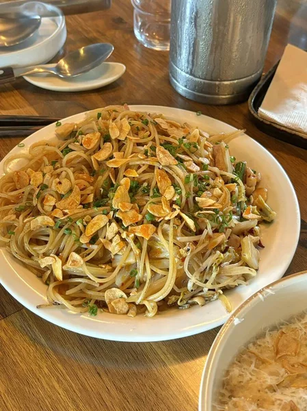 Creamy spaghetti carbonara made with rich egg yolk sauce, crispy bacon, parmesan cheese, and freshly ground black pepper for a classic, indulgent Italian pasta dish.