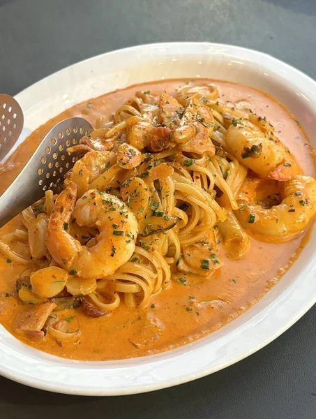 Creamy spaghetti carbonara made with rich egg yolk sauce, crispy bacon, parmesan cheese, and freshly ground black pepper for a classic, indulgent Italian pasta dish.