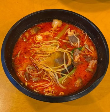 Spicy and numbing malatang with a mix of fresh ingredients in rich Sichuan broth, paired with crispy and tangy guobaorou. A perfect balance of bold heat and sweet-sour crunch for a Chinese feast.