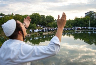 A Jewish man prays during celebration of Rosh  clipart