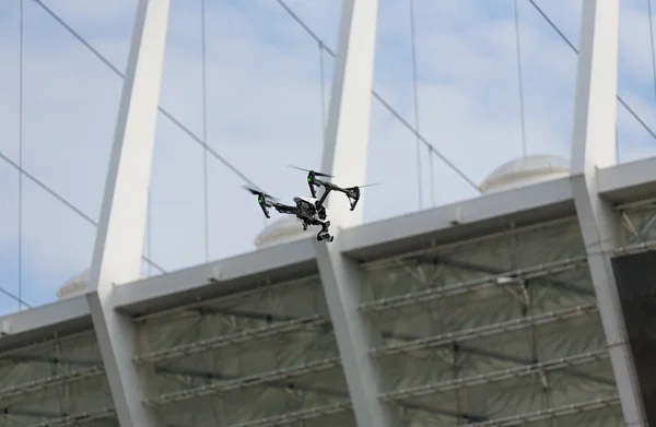 Professional drone flying city streets. Drone on city background. Spy drone, City landscape. Copter flying above the city.