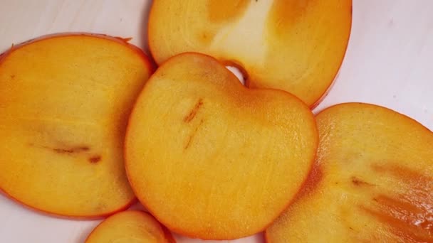 Tranché persimmon frais gros plan tourne — Video