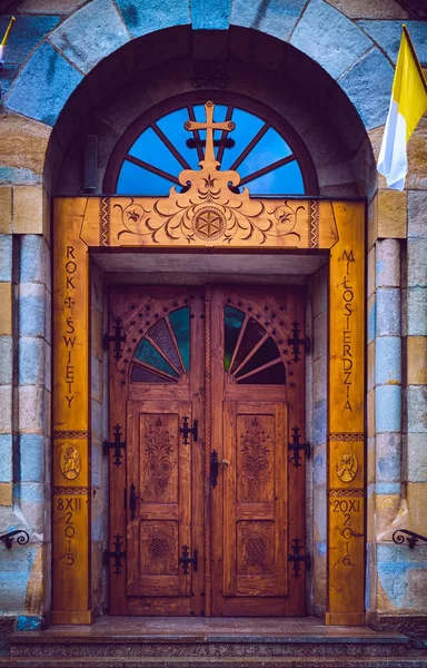 left entrance gate to the Church in Zakopane, Polish Tatra mountains