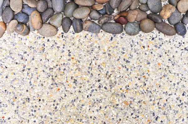 Small stone on gravel background — Stock Photo, Image