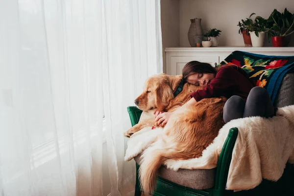 Girl Sitting Armchair Cuddling Her Dog — Stock Photo, Image