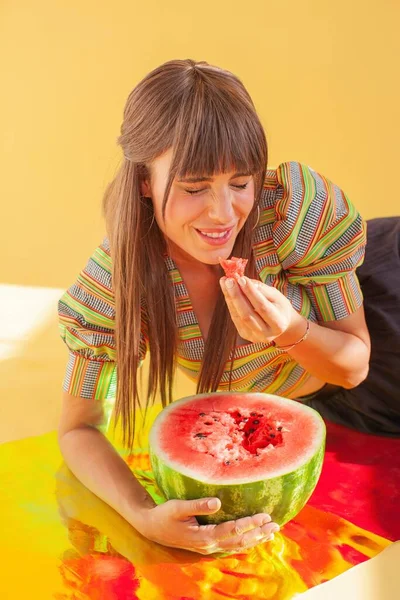 Laughing Woman Sitting Holographic Foil Eating Watermelon — Stock Photo, Image