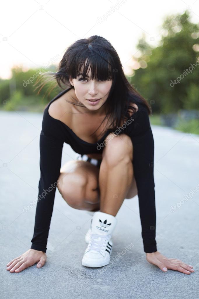 Athletic girl  after training relax .Beautiful sport woman
