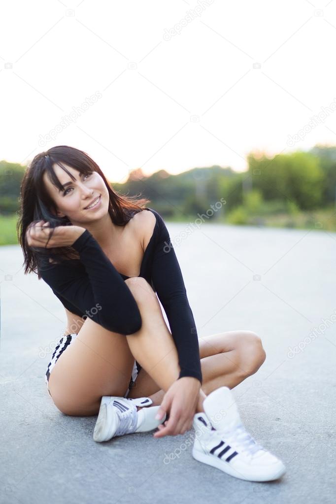 Athletic girl  after training relax .Beautiful sport woman