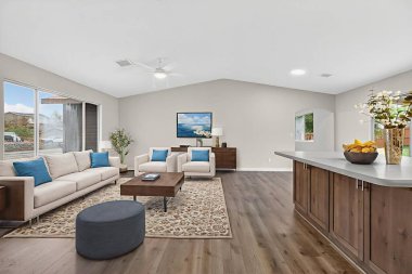 Bölgesel kanepesi ve kahve masası olan geniş oturma odası, sosyal toplantılar için tasarlanmış açık salon.