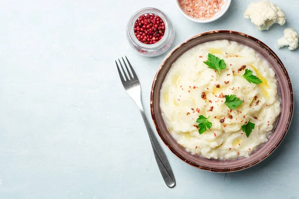Mashed Cauliflower Butter Pink Peppercorns Parsley Concrete Background Top View — Stock Photo, Image