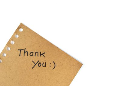 Thank you message hand written on brown paper on white background with smile emoji, Copy space