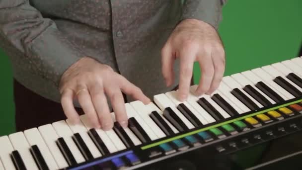 Musician plays a synthesizer — Stock Video