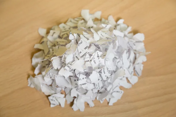 Torn pieces of paper with the text on the table — Stock Photo, Image