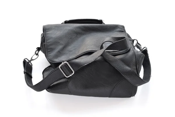 Black wrinkled leather bag with shoulder strap. — Stock Photo, Image