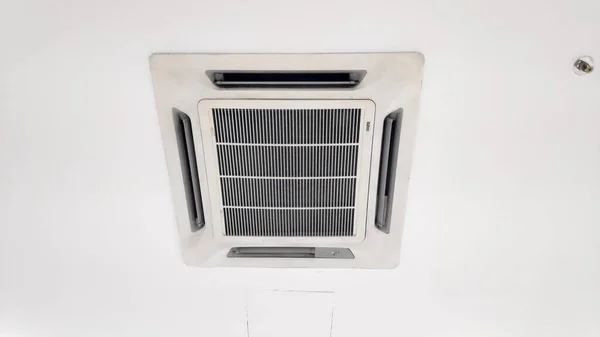 close-up photo of the indoor unit of an air conditioner and the indoor ventilation duct filter