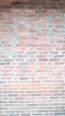 Kırsal kırmızı tuğla duvar dokusu arkaplanının tam kare dikey görüntüsü