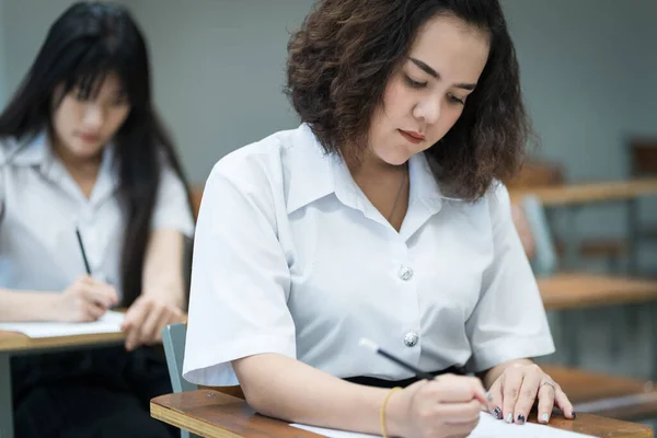 Selective Focus Teenage College Students Sit Lecture Chairs Final Examination — Stock Photo, Image