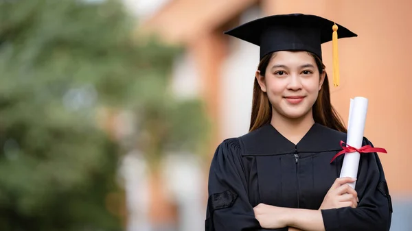 Young Happy Asian Woman University Graduate Graduation Gown Mortarboard Holds — Stock Photo, Image