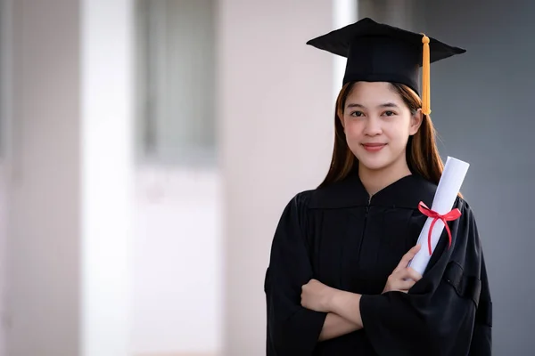 Young Happy Asian Woman University Graduate Graduation Gown Mortarboard Holds — Stock Photo, Image