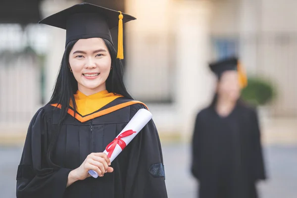 Young Asian Woman University Graduate Graduation Gown Mortarboard Holds Degree — Stock Photo, Image