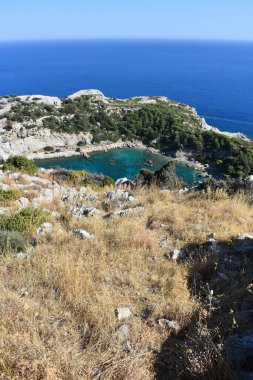 Anthony Quinn Bay, Rhodes Island, Greece. View from Anthony Quinn viewpoint. Panoramic sea paradise landscape. Travel to Greece. Summer and holidays. Bird's eye view from above, rocks, clear sea.