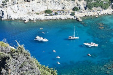 Anthony Quinn Bay, Rhodes Island, Greece. View from Anthony Quinn viewpoint. Panoramic sea paradise landscape. Travel to Greece. Summer and holidays. Bird's eye view from above, rocks, clear sea
