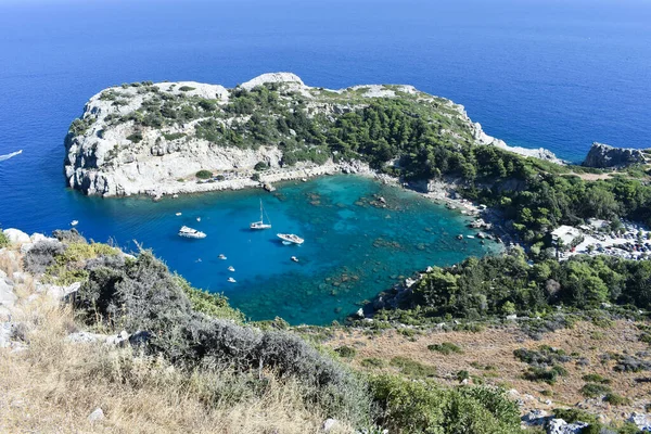 Anthony Quinn Bay, Rhodes Island, Greece. View from Anthony Quinn viewpoint. Panoramic sea paradise landscape. Travel to Greece. Summer and holidays. Bird's eye view from above, rocks, clear sea.