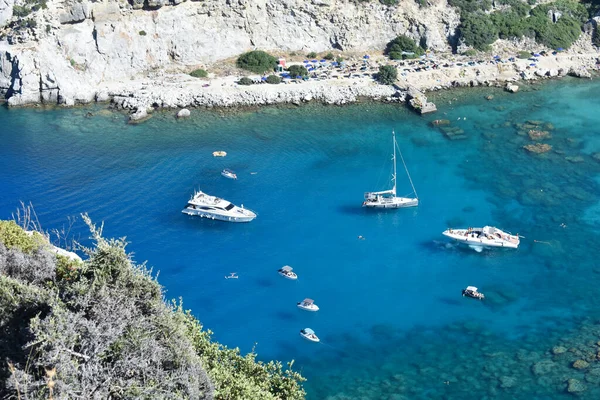 Anthony Quinn Bay, Rhodes Island, Greece. View from Anthony Quinn viewpoint. Panoramic sea paradise landscape. Travel to Greece. Summer and holidays. Bird's eye view from above, rocks, clear sea