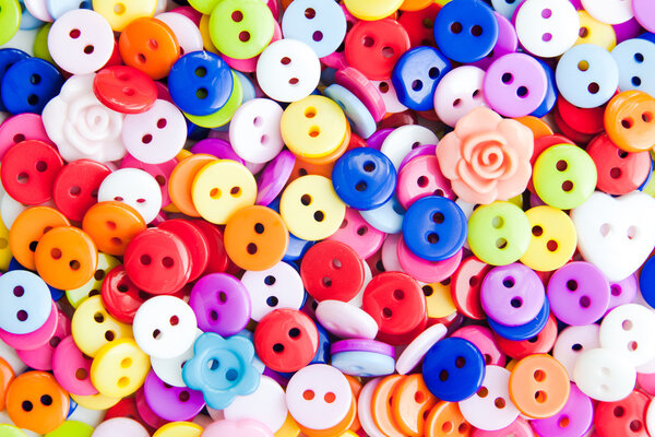 Bright beautiful color buttons for clothes background